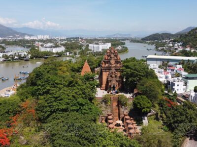 Aerial view of the ancient Po Nagar Cham Towers along the river in Nha Trang, Vietnam.